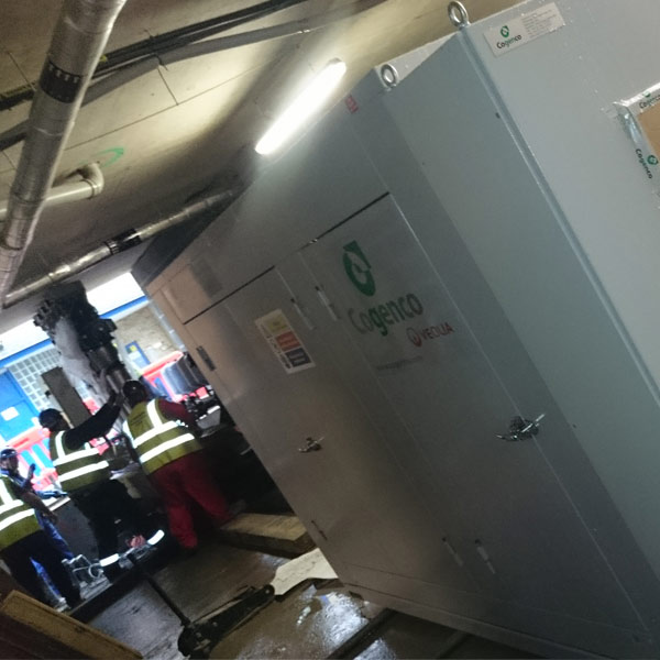 Toe jacks raising CHP unit during staged block descent in basement