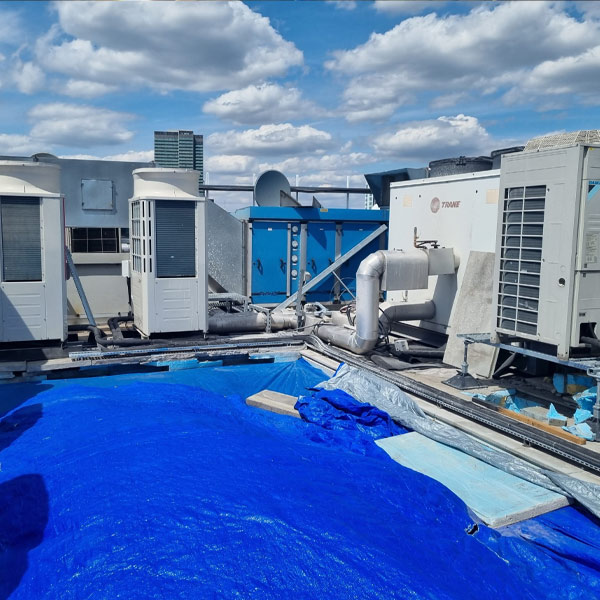 Multiple units before phased roof replacement by scaffold lifting