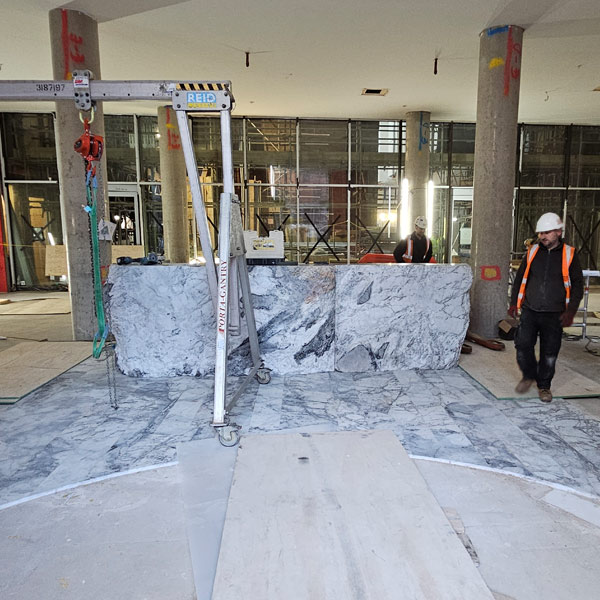 Floor protection laid in new building during marble desk installation